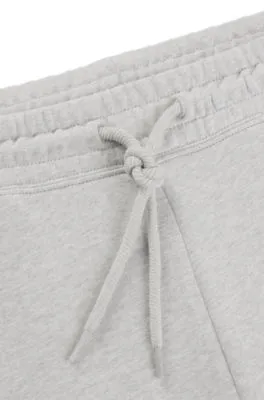 Loose-fit cotton-terry tracksuit bottoms with outline logo