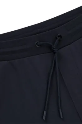 Regular-fit tracksuit bottoms with contrast piping 