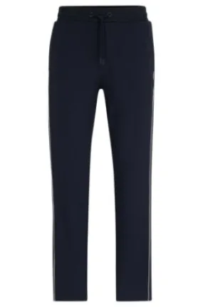 Regular-fit tracksuit bottoms with contrast piping 